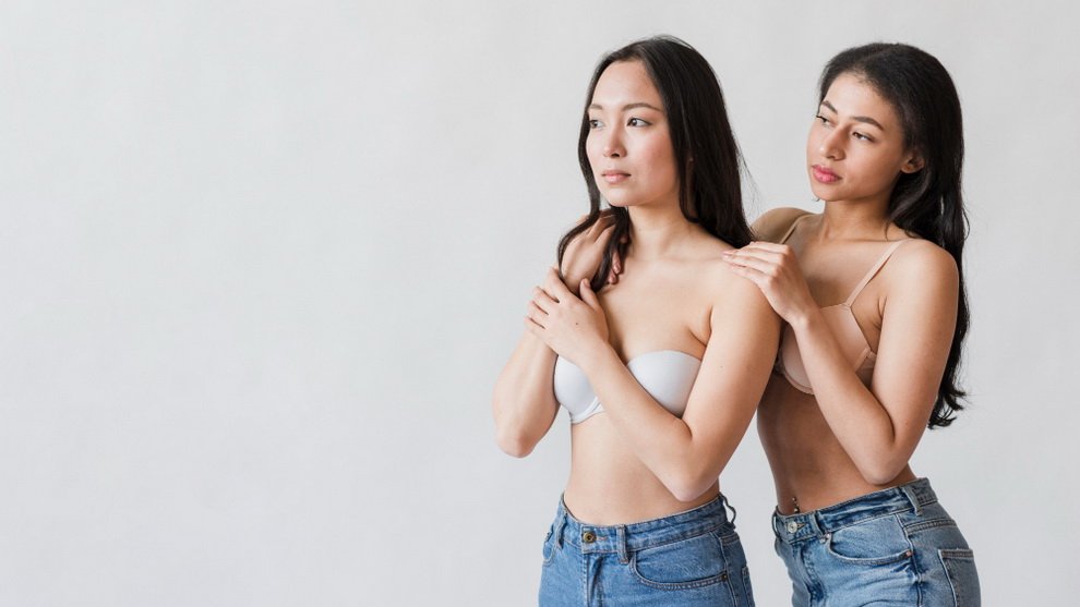hispanic-woman-touching-asian-female-lingerie